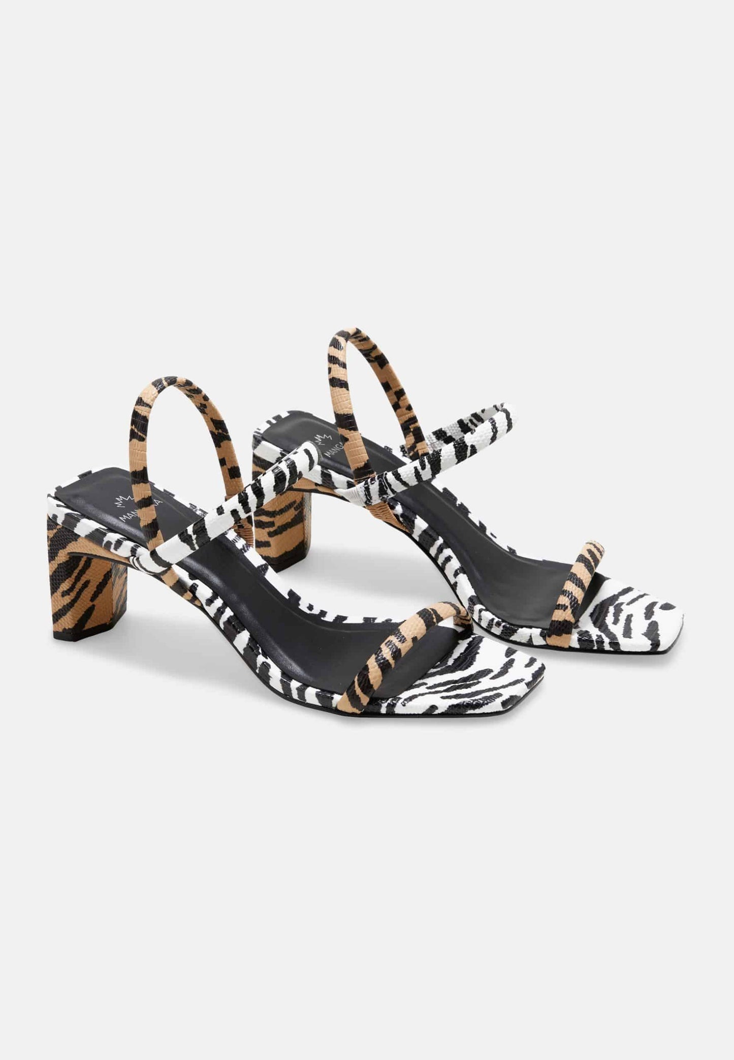Zebra print high-heeled sandals on a white background