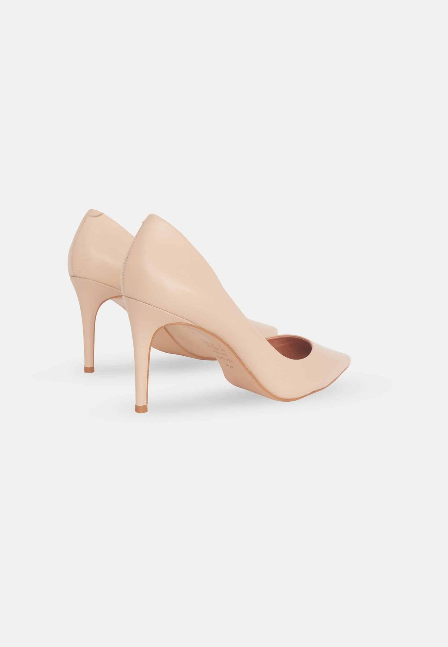 Nude high-heeled shoe on a white background