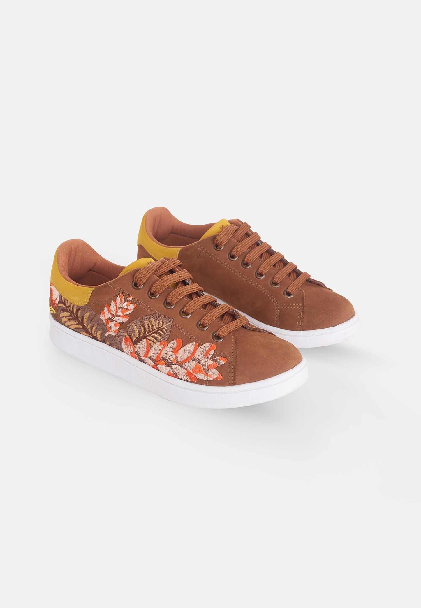 Brown sneakers with floral pattern on a white background