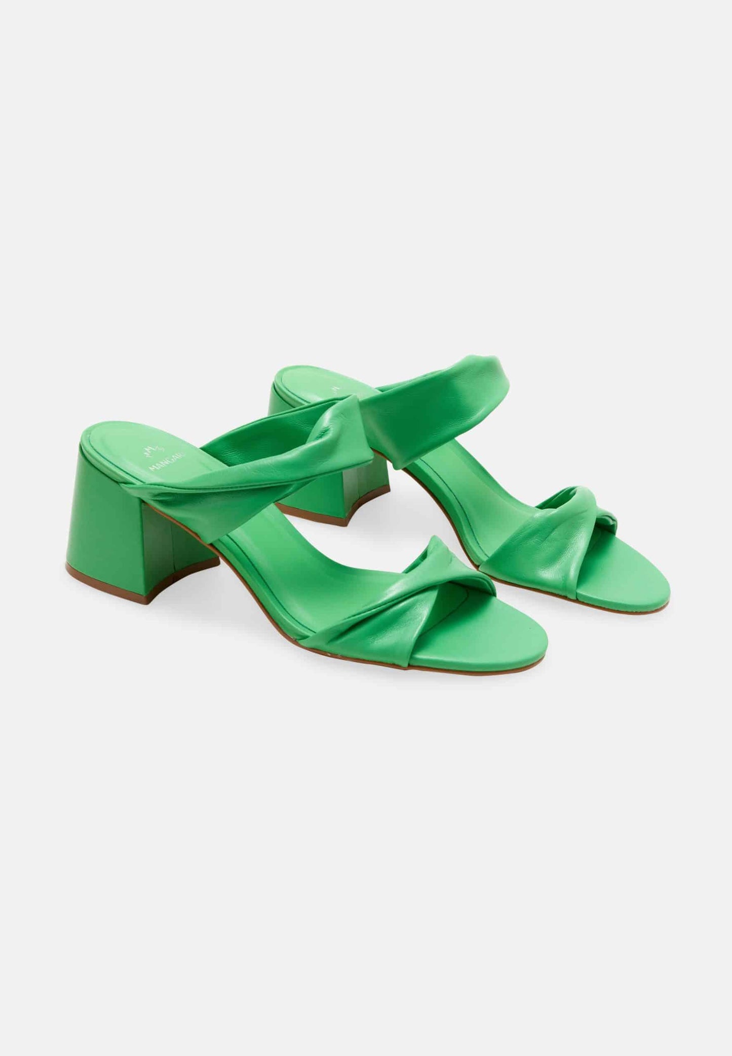 Green high-heeled sandals on a white background