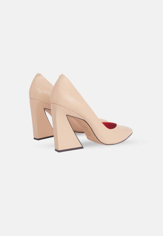 Beige high-heeled shoes on a white background