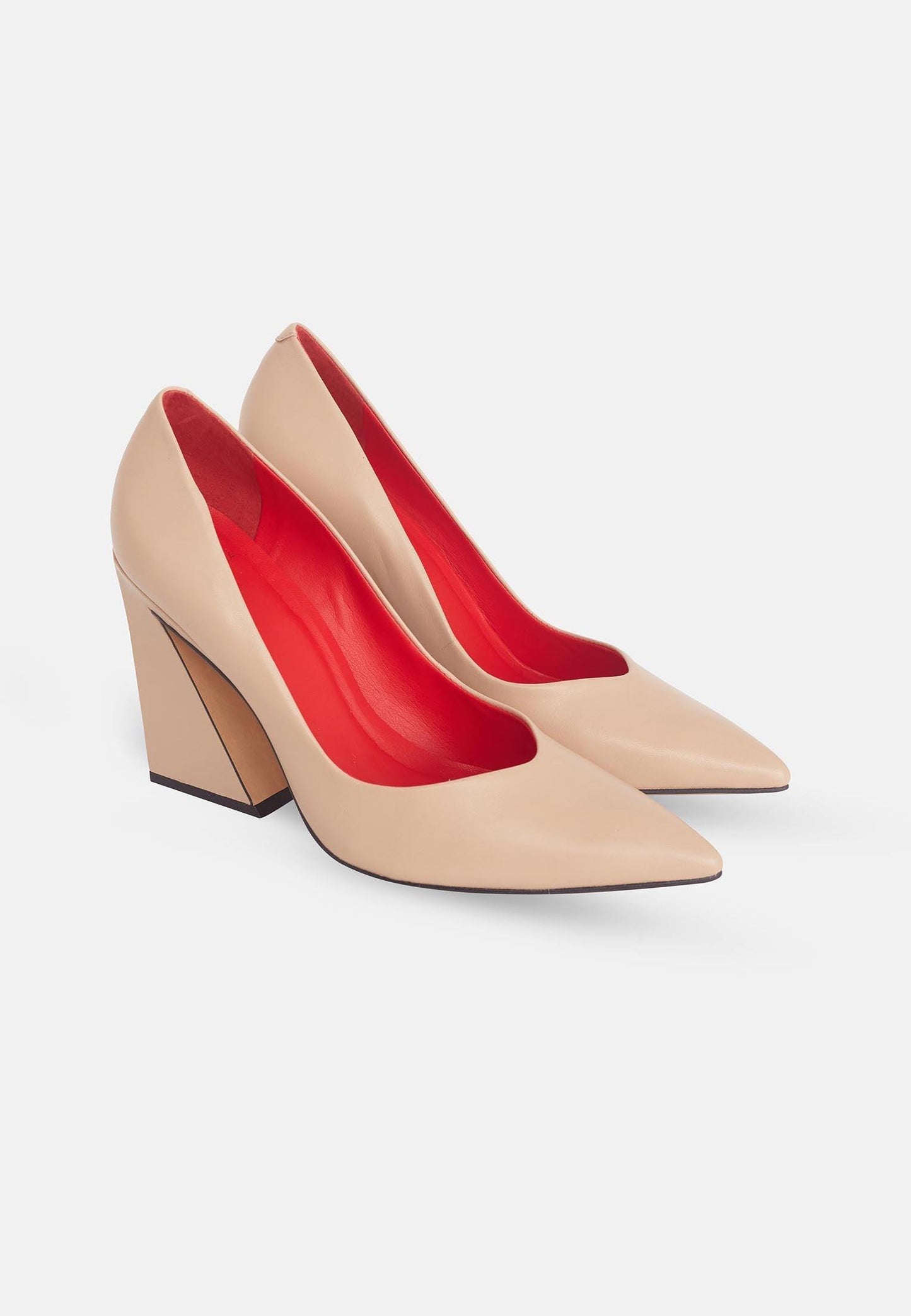 Beige high-heeled shoes with red soles on a white background