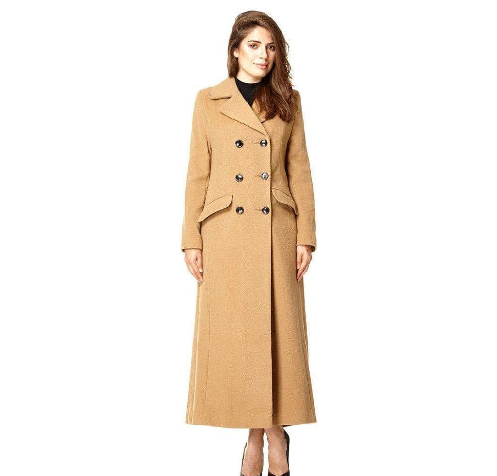 Woman wearing a long beige coat on a white background