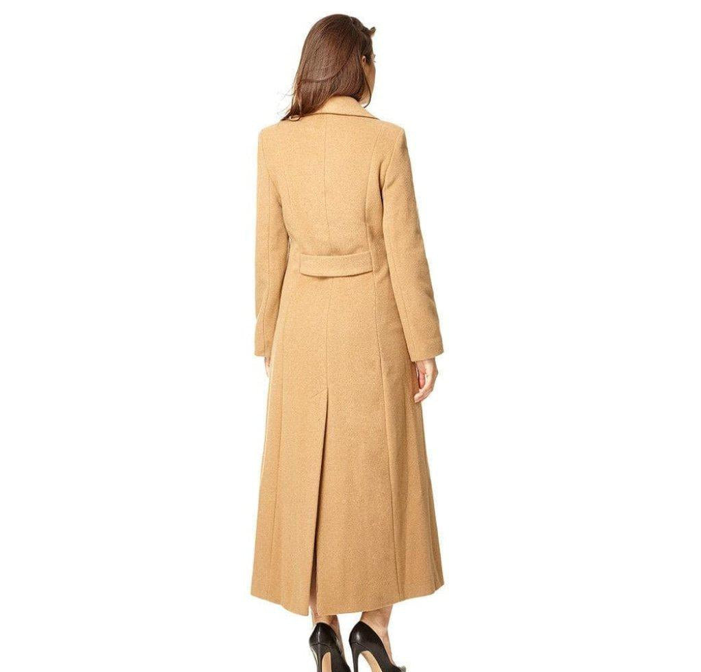 Woman wearing a long beige coat on a white background