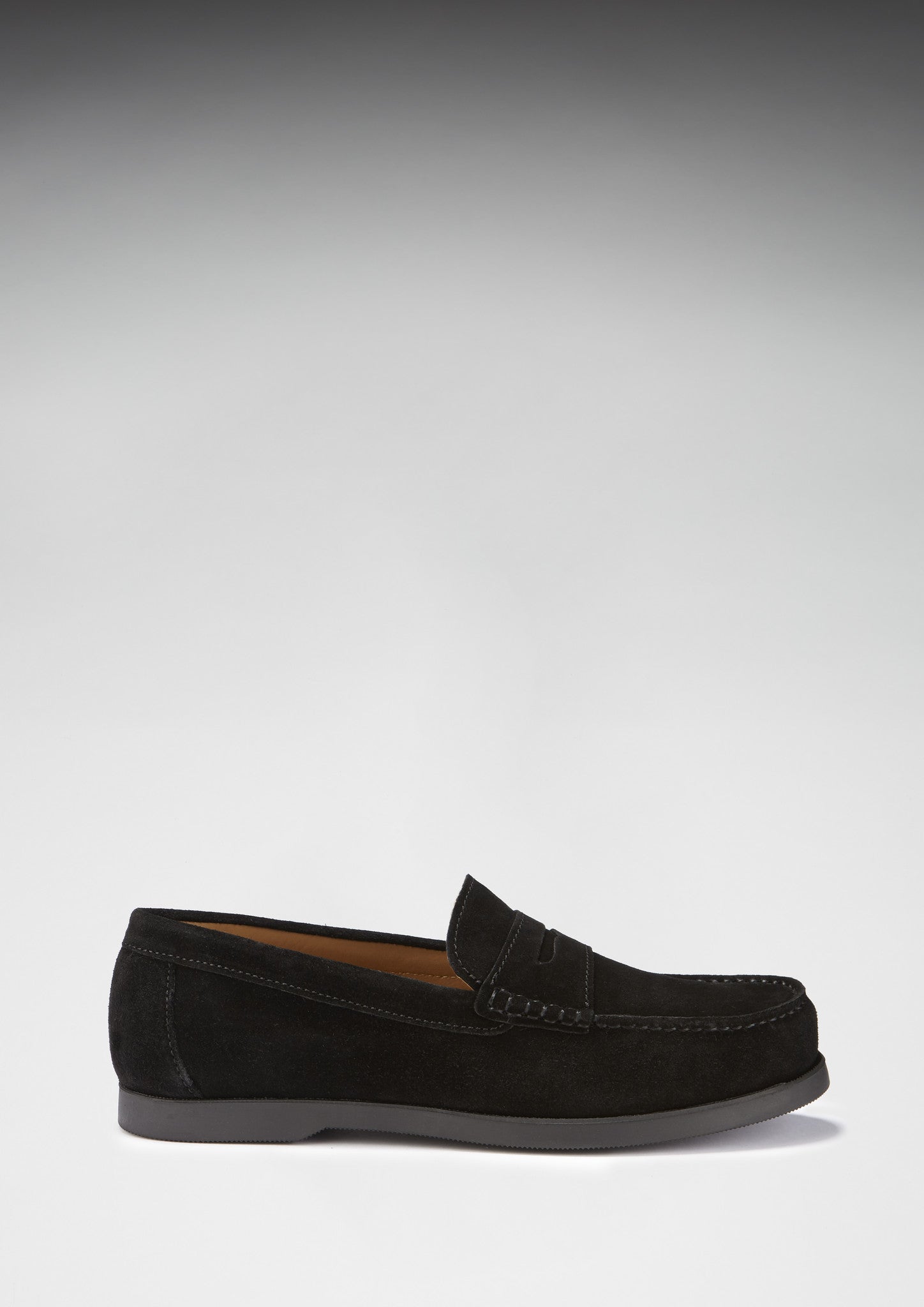 Black loafer shoe on a light gray background