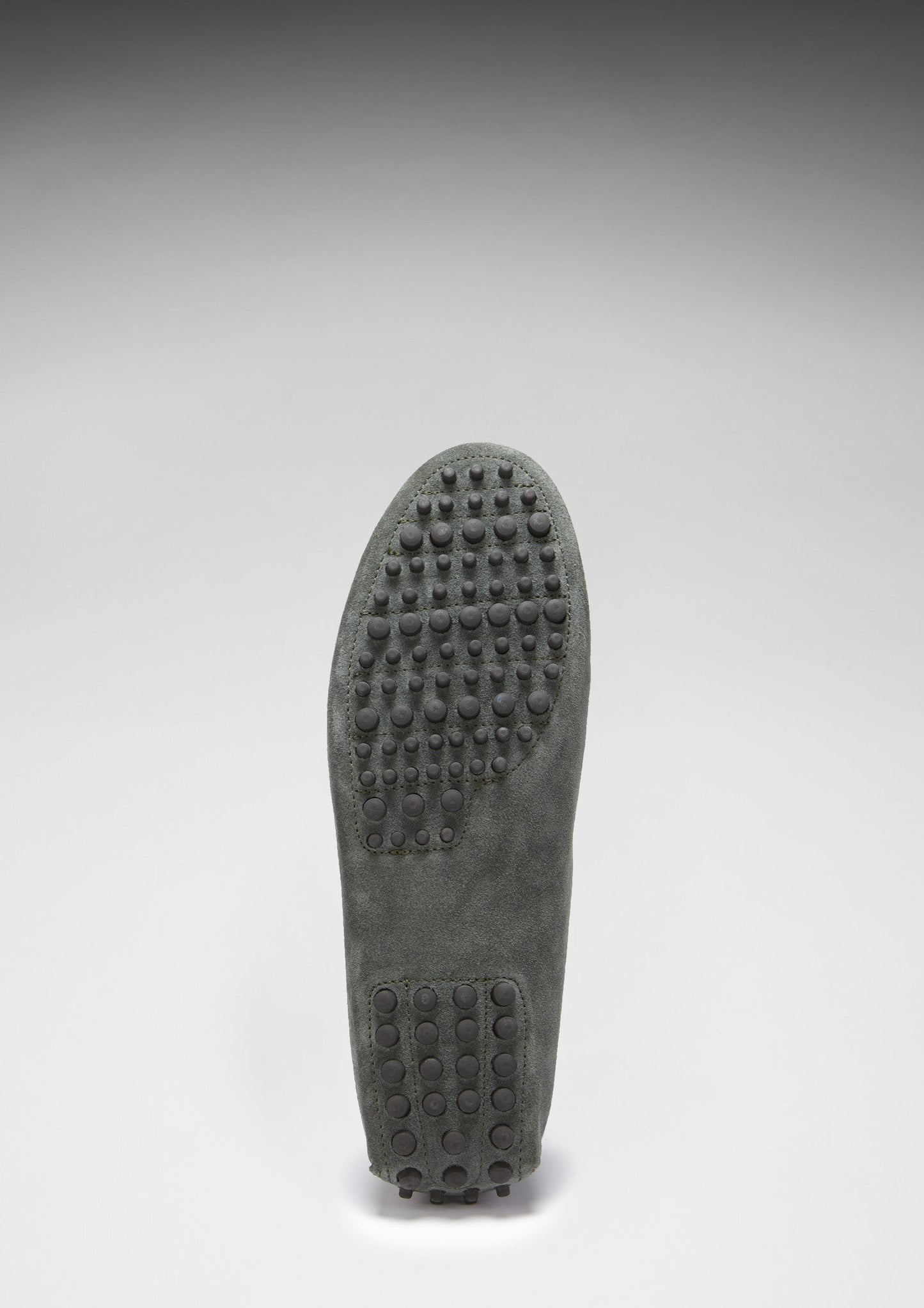 Gray shoe sole with textured pattern on a white background