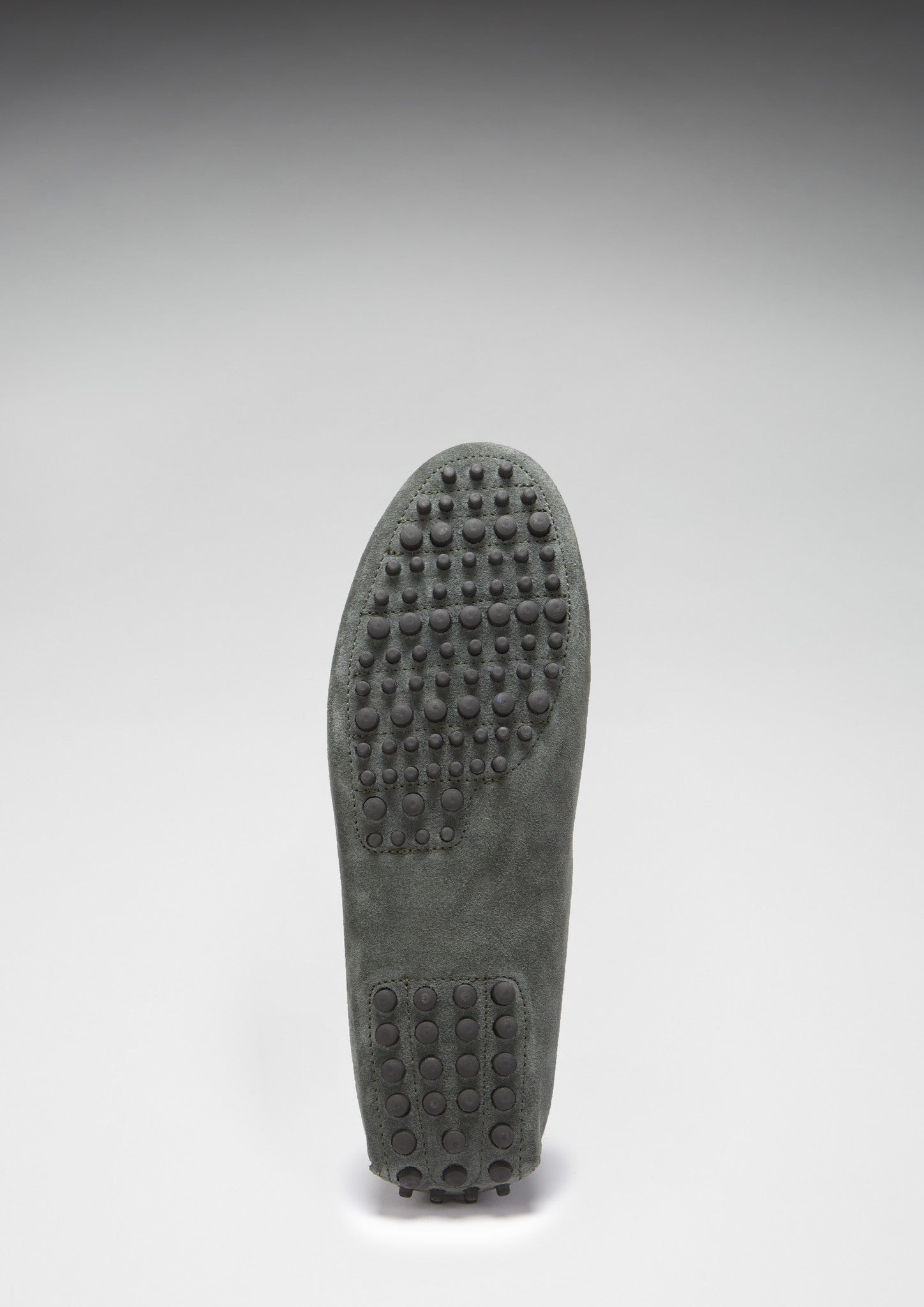 Gray shoe sole with textured pattern on a white background