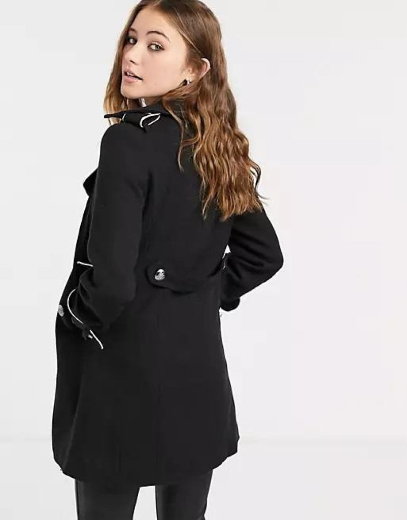 Person wearing a black coat on a white background
