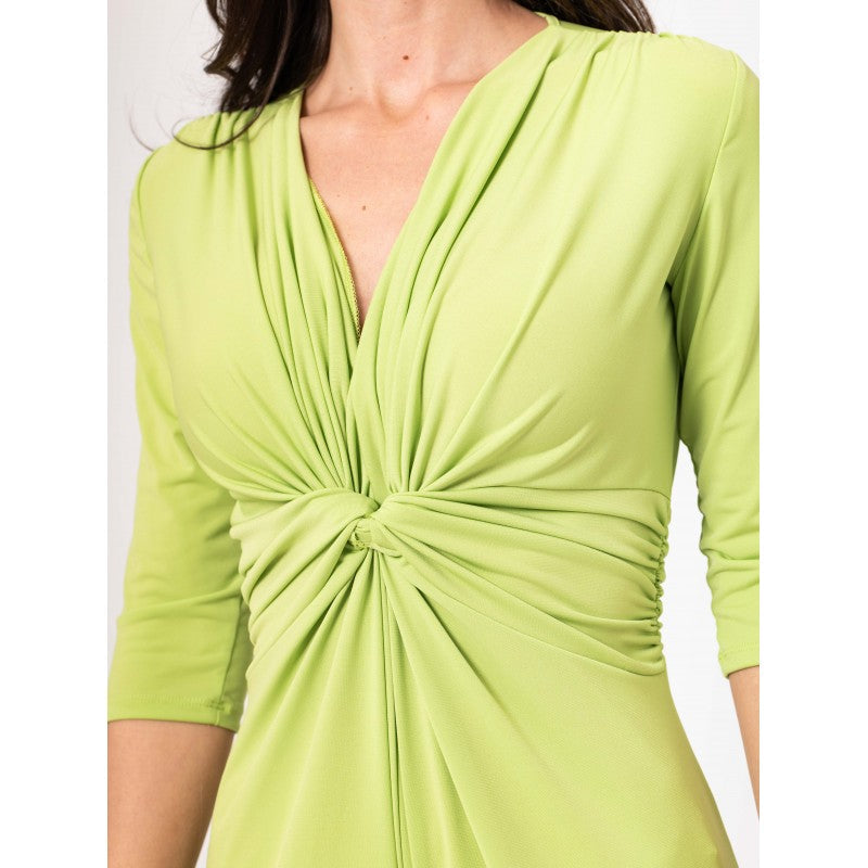 Green dress with a knot detail on a white background