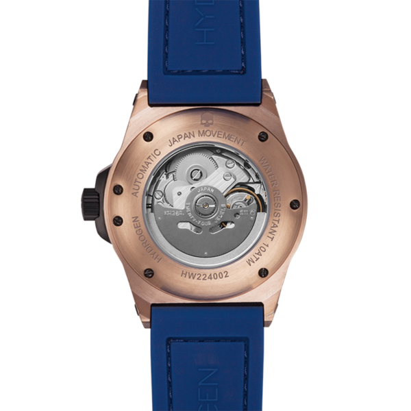 Watch with blue strap and rose gold case on a white background