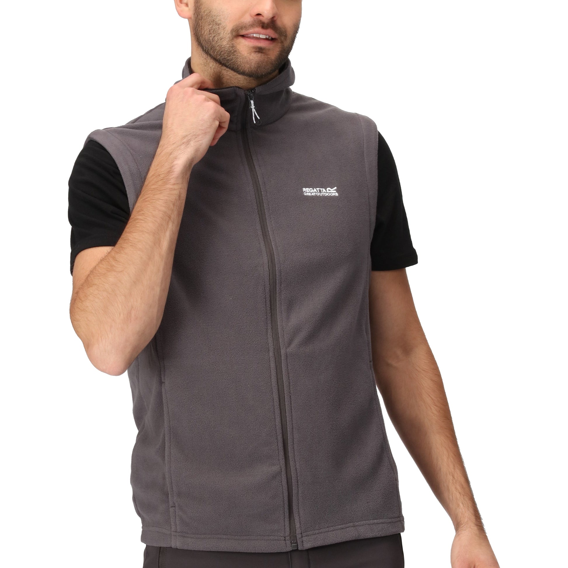 Man wearing a gray vest with a brand logo on a white background