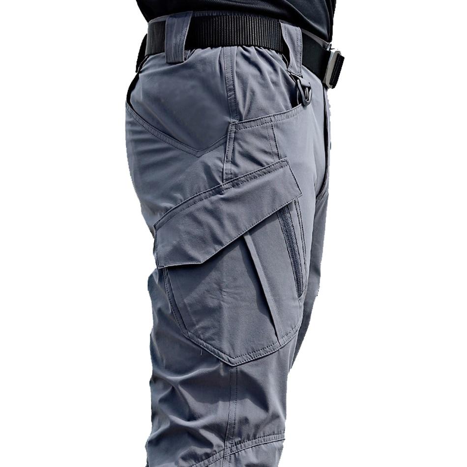Gray tactical pants with multiple pockets on a white background