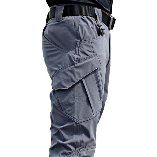 Gray tactical pants with multiple pockets on a white background