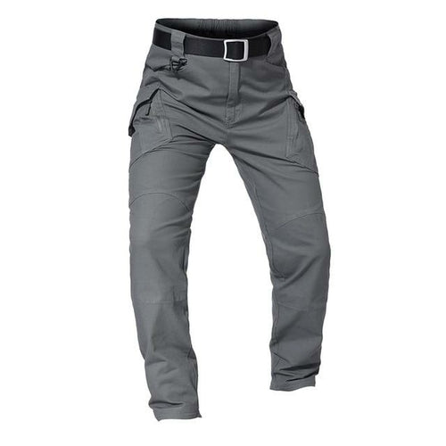Gray tactical pants with multiple pockets and a belt on a white background