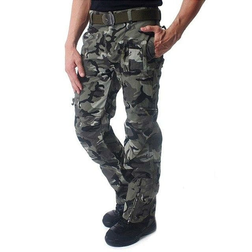 Camouflage pants worn by a person on a white background