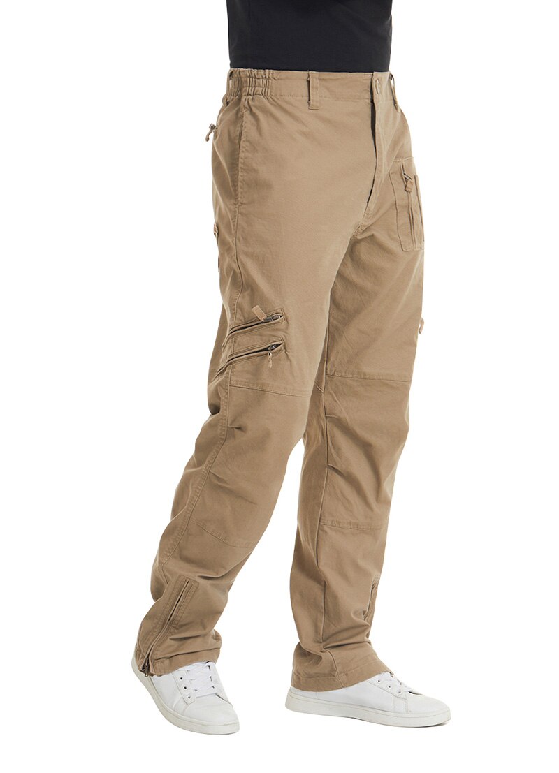 Tan cargo pants worn by a person on a white background