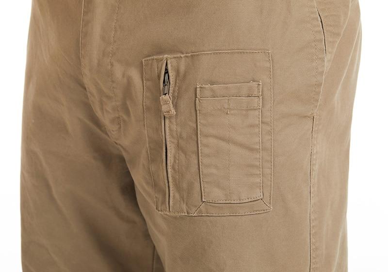 Close-up of brown pants with a pocket on a white background