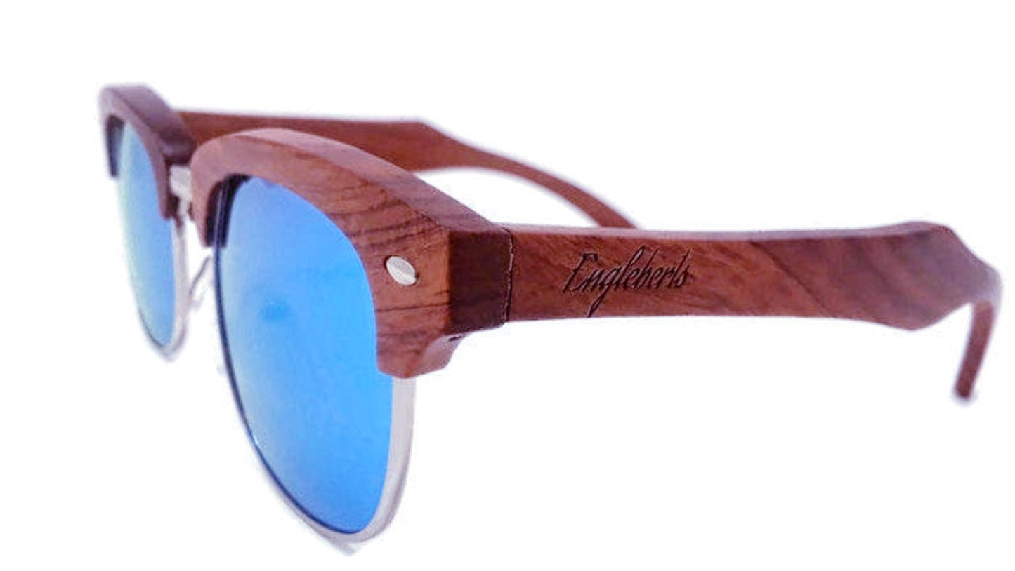 Wooden-framed sunglasses with blue lenses on a white background