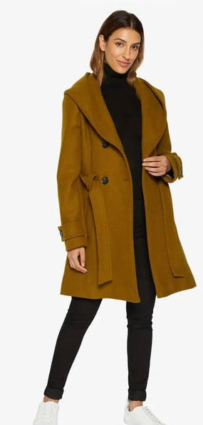 Woman wearing a mustard yellow coat.