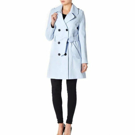 Light blue trench coat worn by a person on a white background
