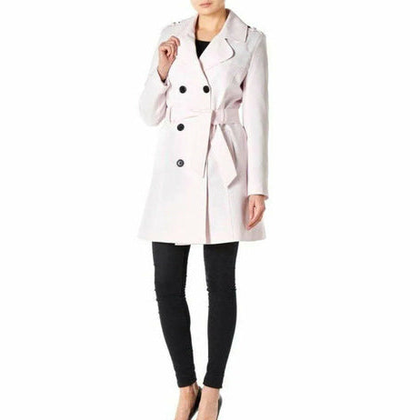 White trench coat worn by a person on a white background