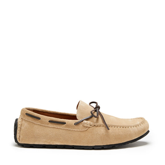 Beige loafer shoe on a white background