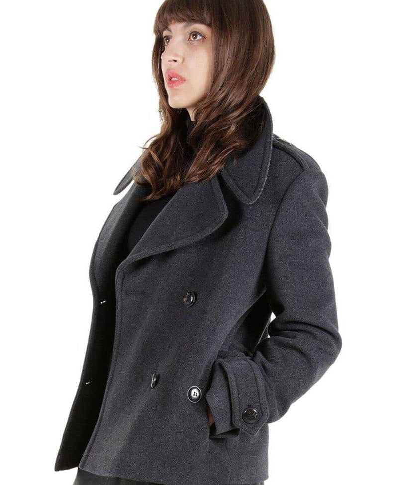 Woman wearing a gray coat on a white background