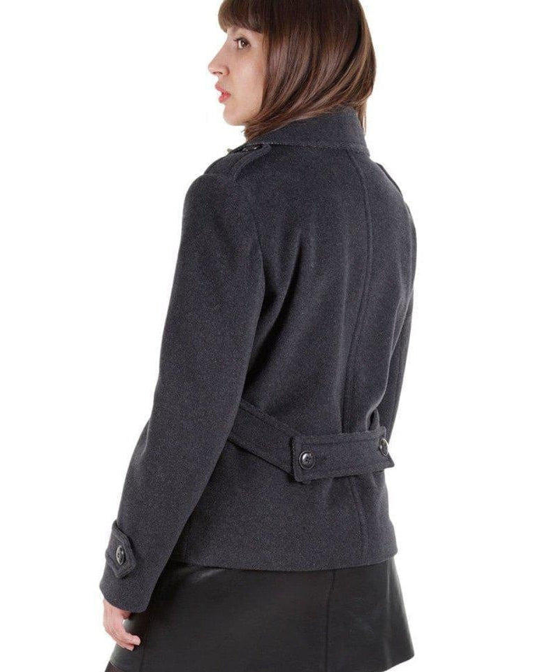 Person wearing a dark gray jacket on a white background