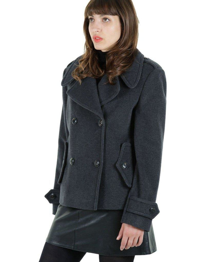 Woman wearing a gray coat on a white background