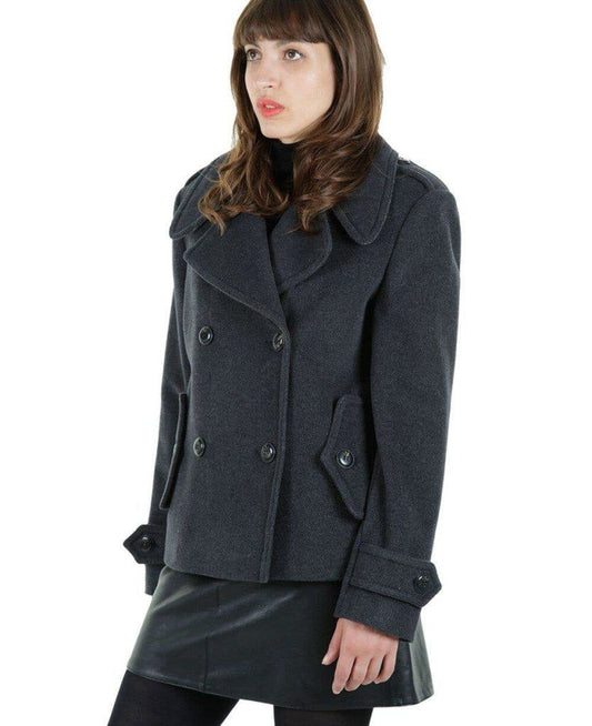 Woman wearing a gray coat on a white background