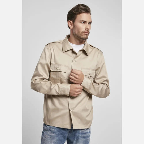 Man wearing a beige jacket on a light gray background