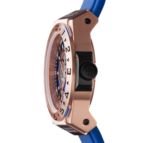 Close-up of a watch with a blue strap and rose gold casing on a white background