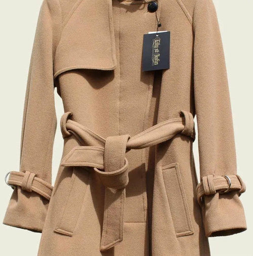 Beige trench coat with a tag on a light beige background