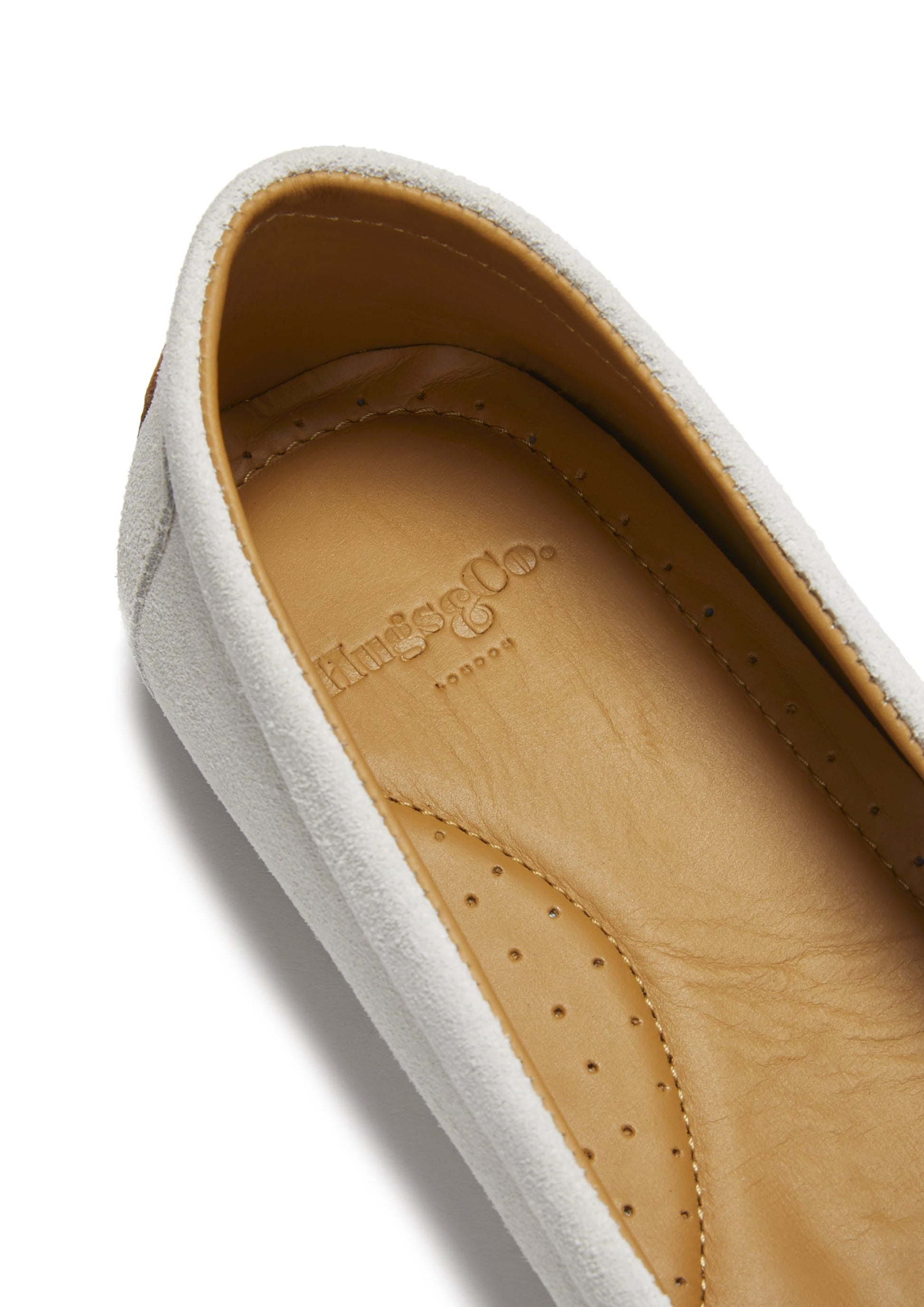 Close-up of a shoe sole with branding on a white background