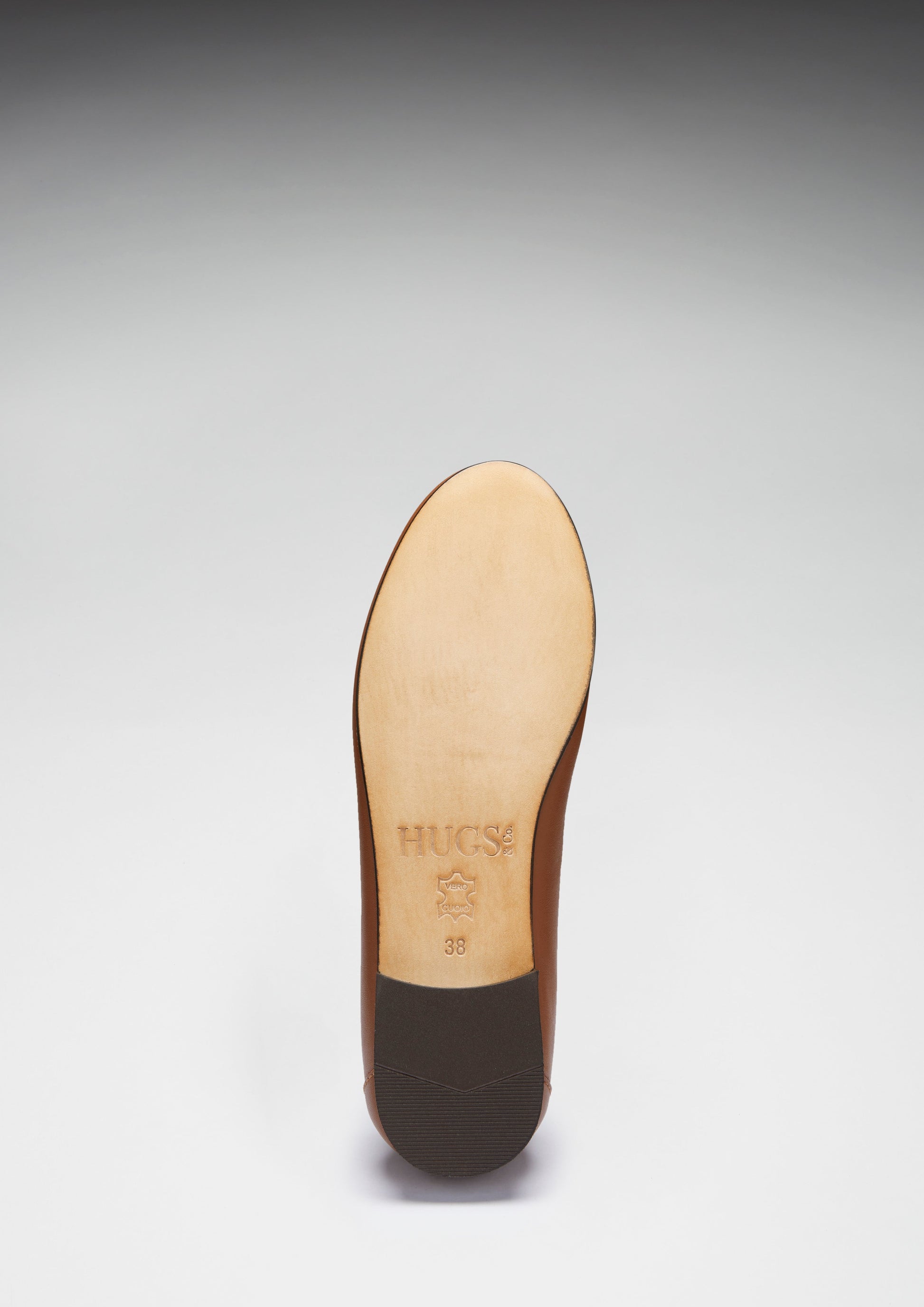 Shoe sole with branding on a gray background