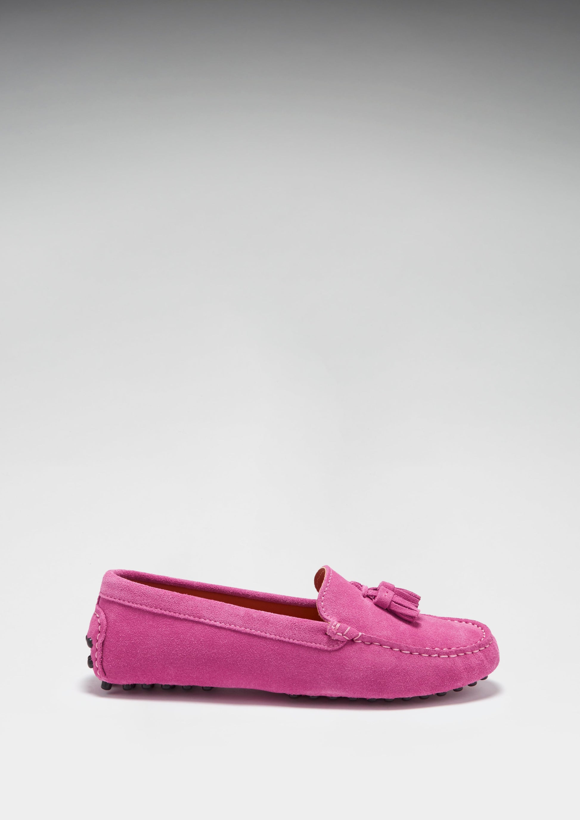 Pink loafer shoe on a light gray background