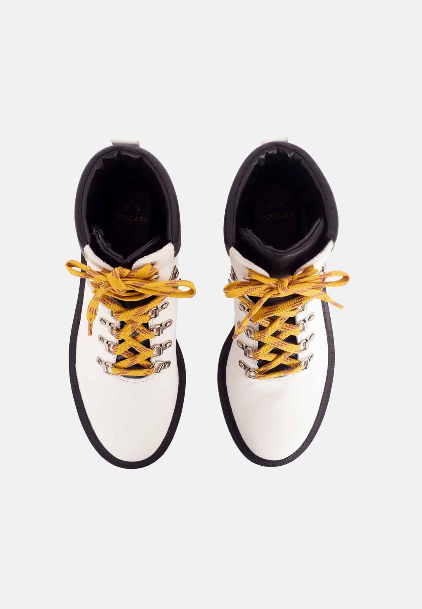 White boots with yellow laces on a white background