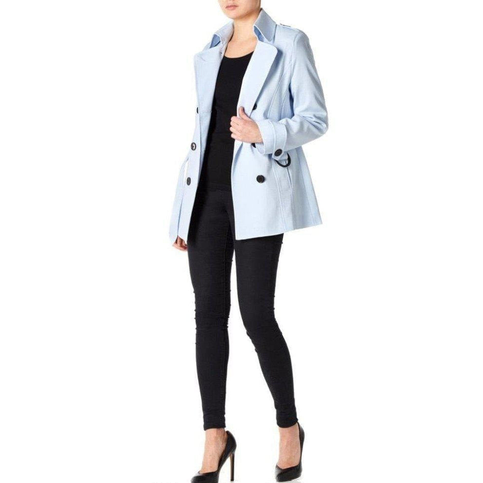 Light blue coat worn by a person on a white background