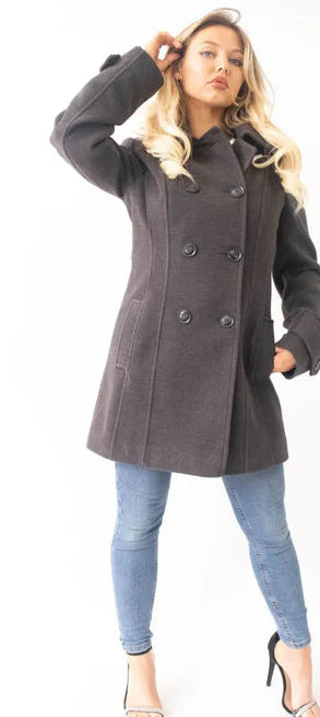 Woman wearing a gray coat with a white background