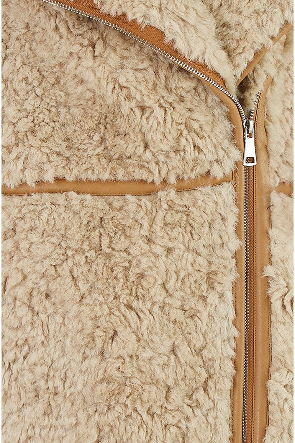Close-up of a beige sherpa jacket with a zipper