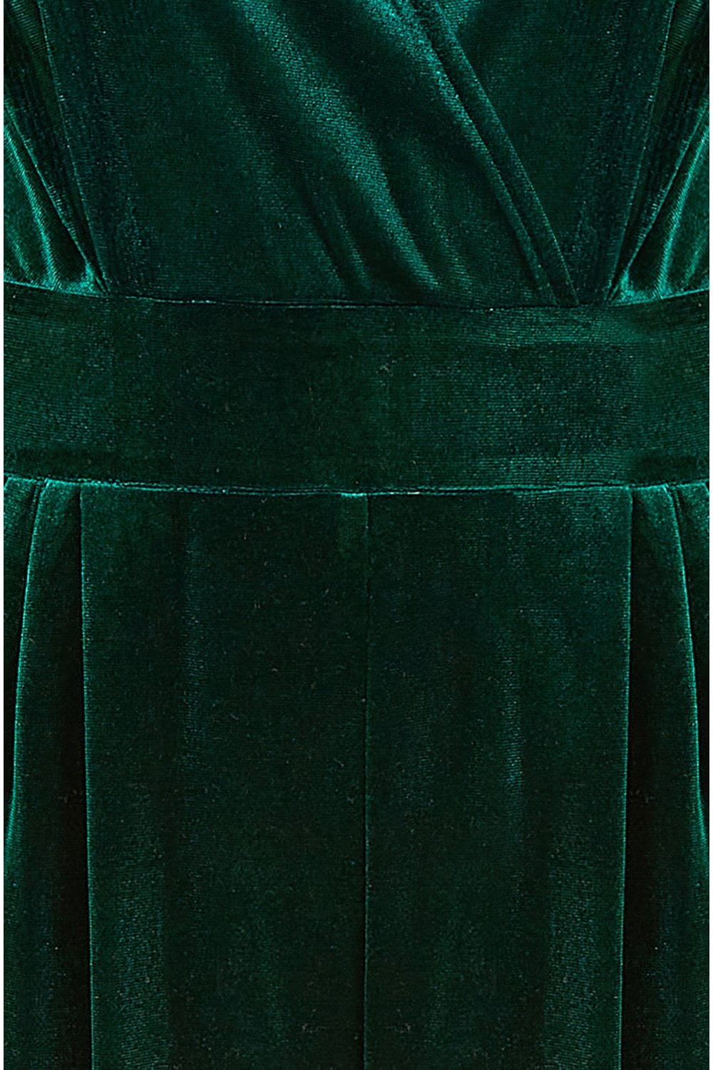 Close-up of a green velvet dress with a focus on the waistband.