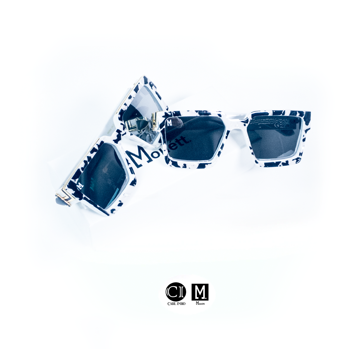Blue and white patterned sunglasses on a white background with 'CM' logo.